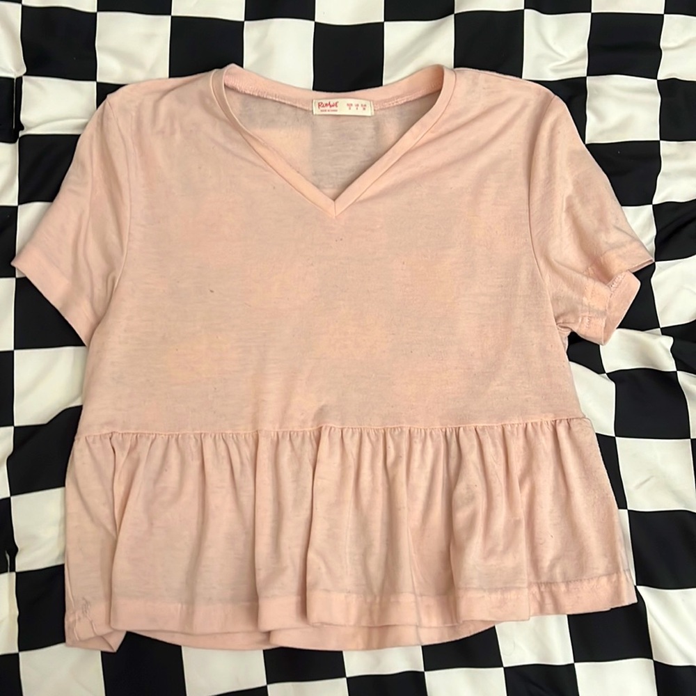 It is a pink V-neck crop top from ROMWE.